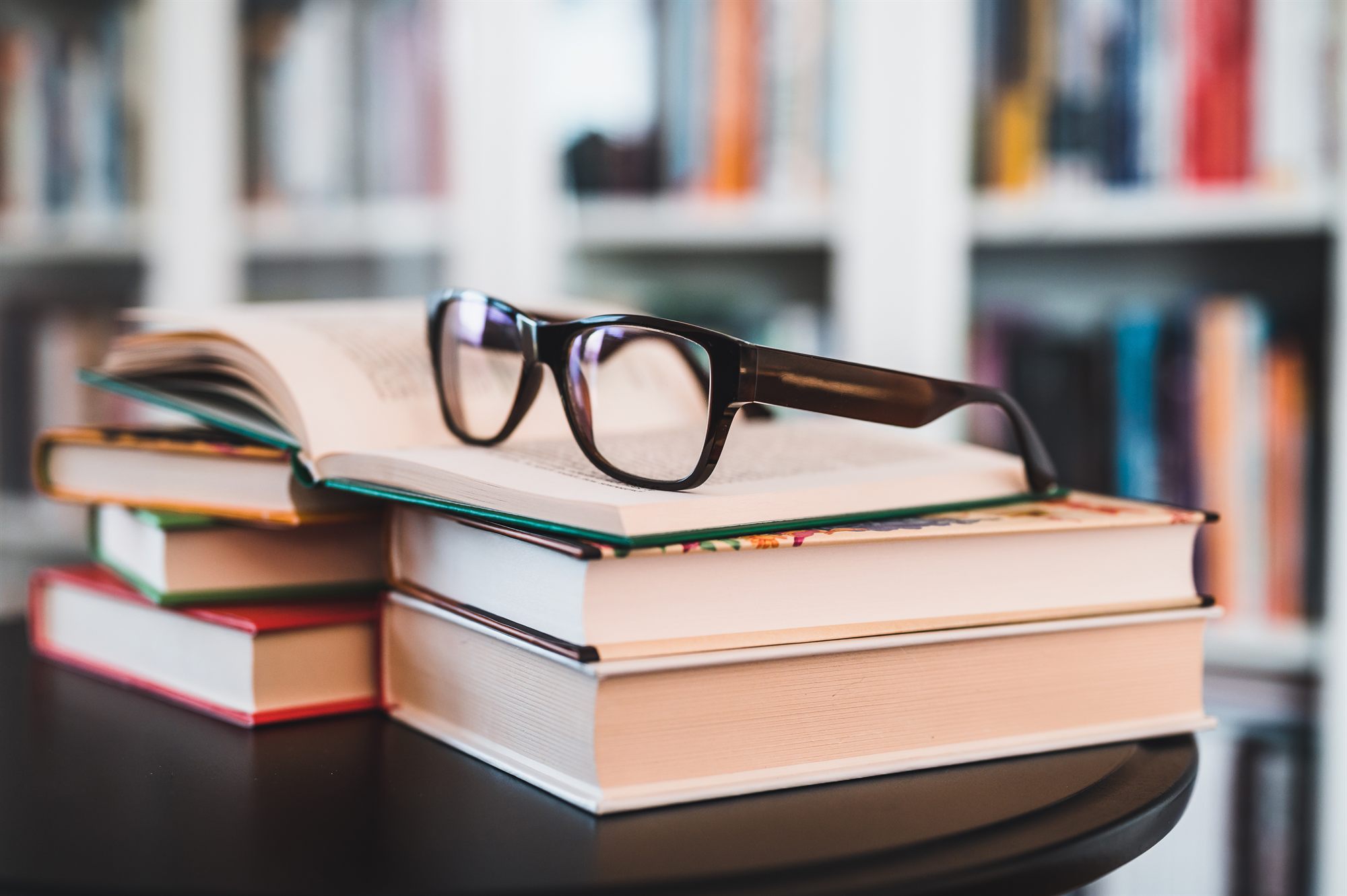 Working notes — open journal and reading glasses