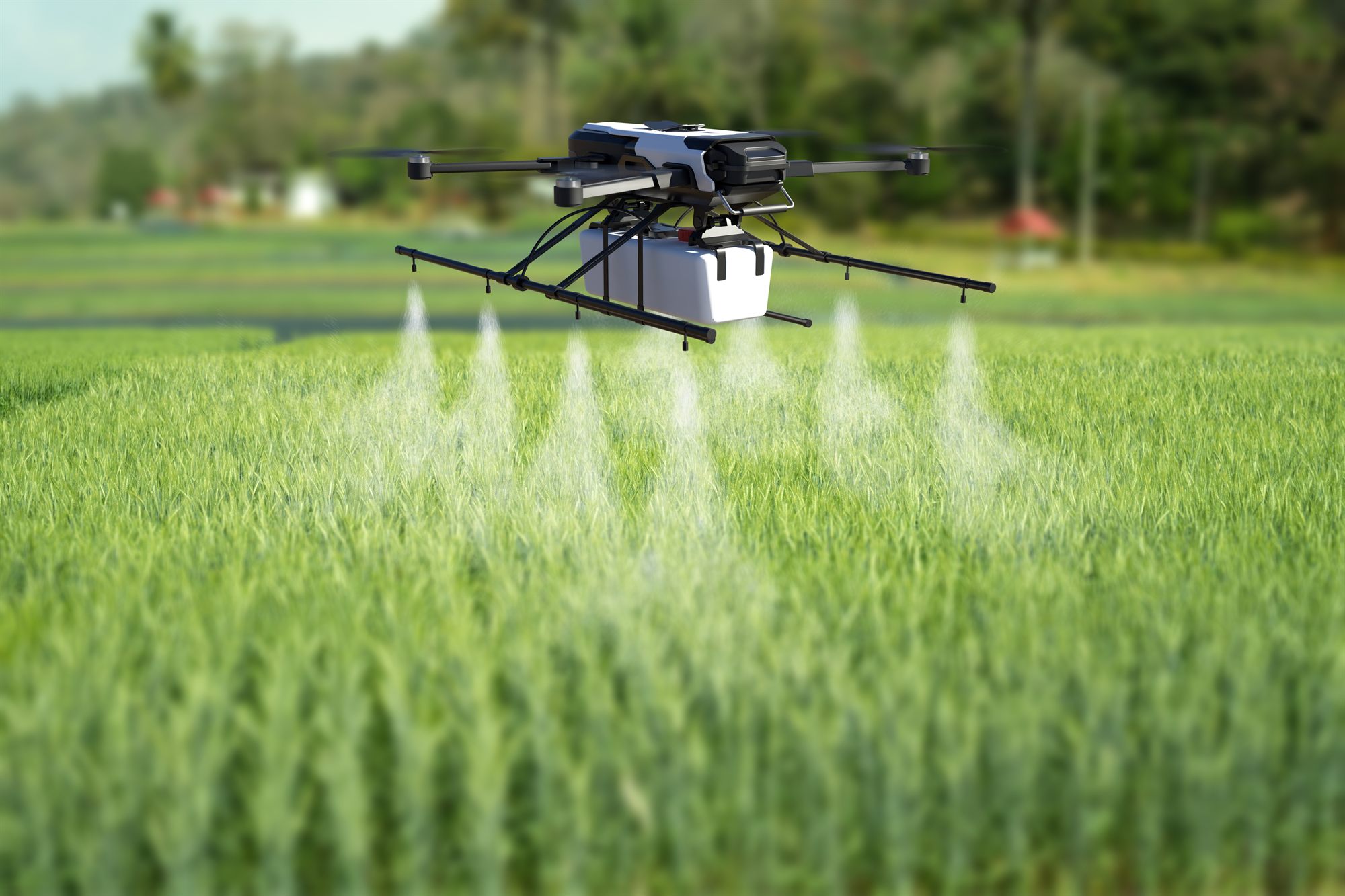 Agricultural drone spraying a field of crops